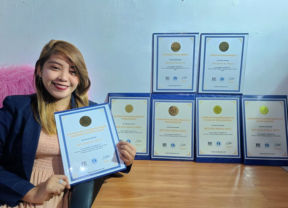 Picture of Ms Jean BM with certificates